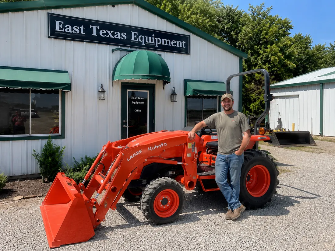 Happy East Texas Equipment customer with their new Kubota tractor outside our Mount Vernon office