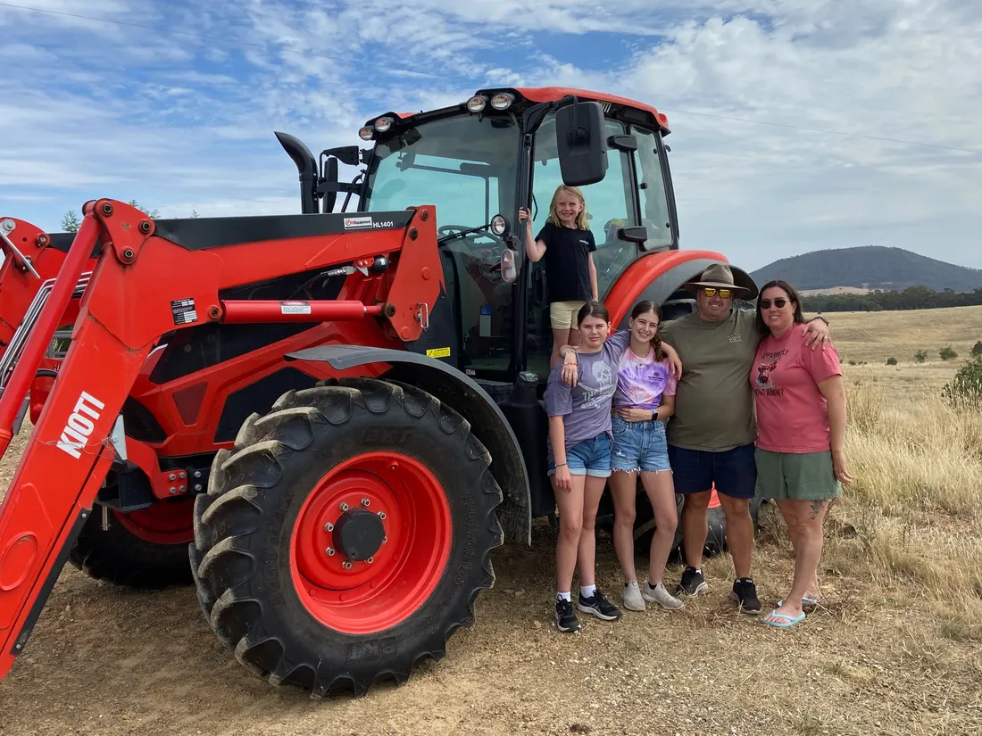 Family picking up their new Kioti tractor from East Texas Equipment