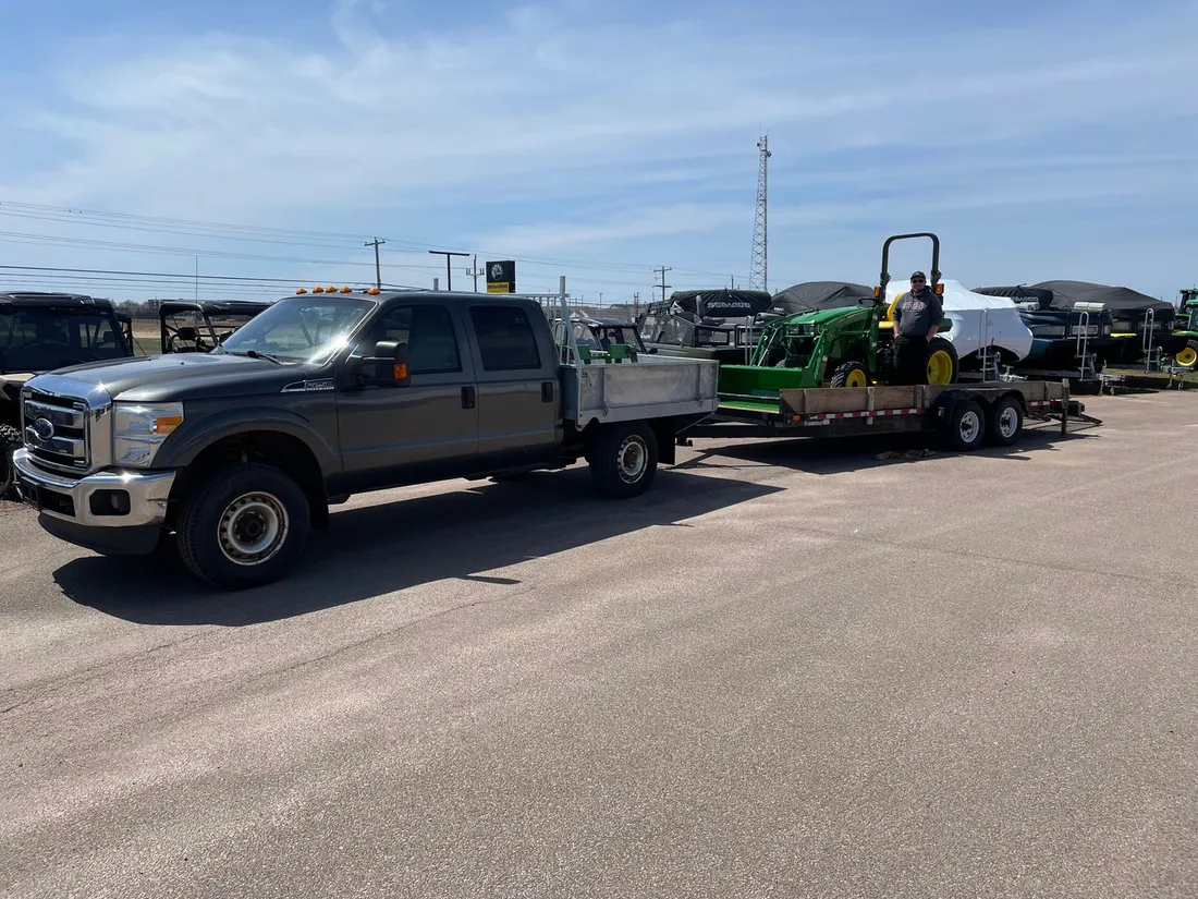 A John Deere tractor loaded and ready to haul home from East Texas Equipment